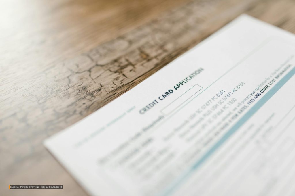 Elderly Person Updating Social Welfare Application Documents